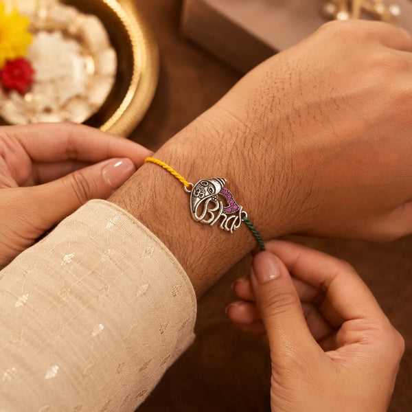 Om Ganesha Silver Rakhi with Purple Stones