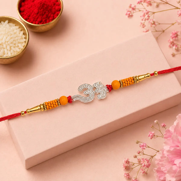 Crystal Om Silver Rakhi with Orange Beads
