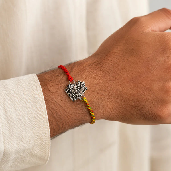 Lord Ganesha Silver Rakhi with Braided Multicolour Thread