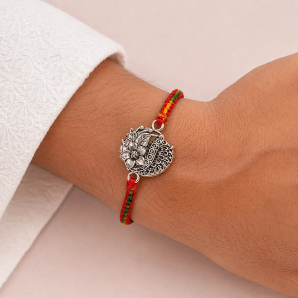 Lotus Paisley Silver Rakhi with Multicolour Thread