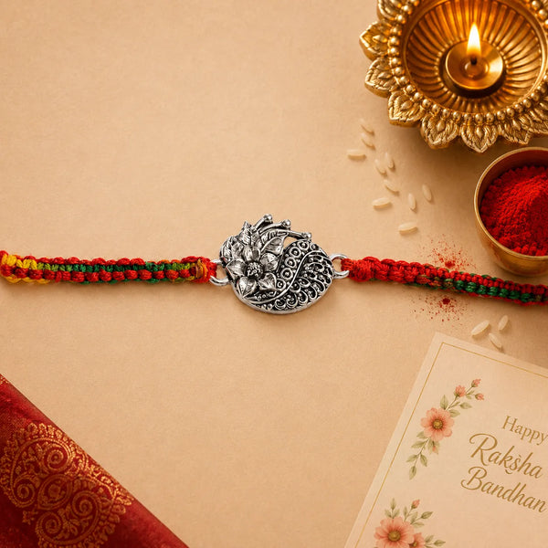 Lotus Paisley Silver Rakhi with Multicolour Thread